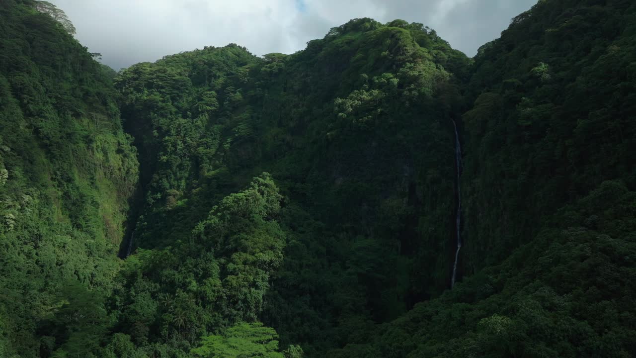Faarumai Waterfall Falls Valley Tahiti French Polynesia aerial drone Vaimahuta Fall Tiarei Hitiaa O Te Ra watershed picturesque river cascades trees forest jungle daytime sunny blue sky forward reveal