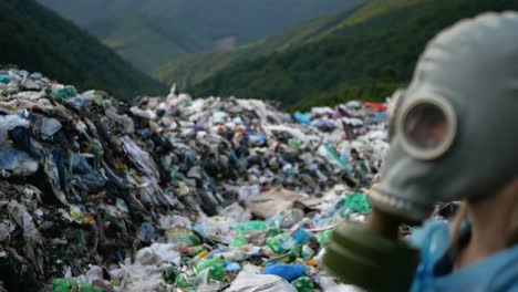ecological catastrophe apocalypse or armageddon concept man is wearing gas mask poor culture of consumption to achieve the progress of modern civilization gives a negative impact on the surrounding nature ecological catastrophe in the background of carpathians
