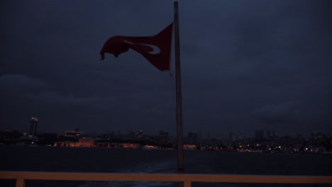 turkish flag waving at night, besiktas view, bosphorus, turkey
