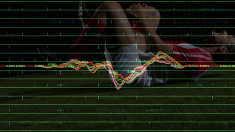 animation of graphs and data over caucasian soccer player suffering at stadium