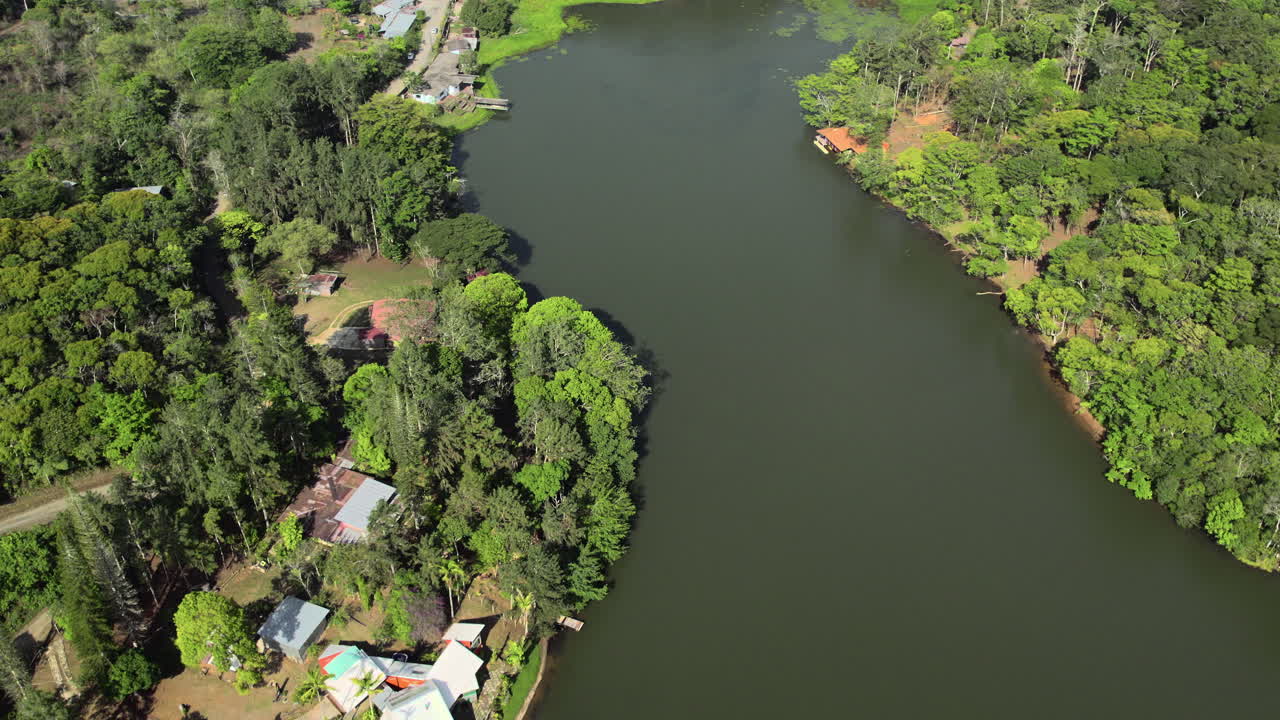 Revealing shot of waterfront villas in the mountains at Cerro Azul