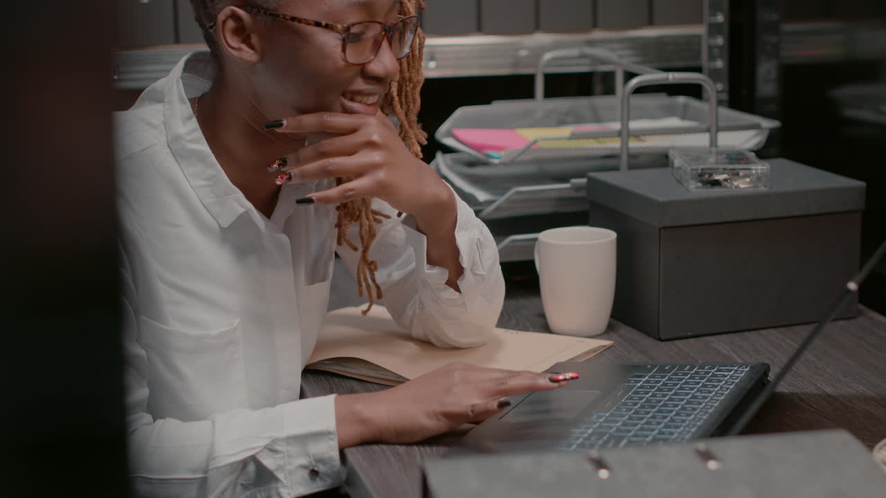 Woman Working on Laptop in Office