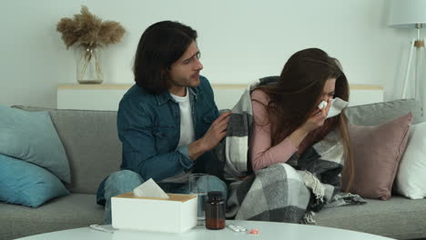 caring man supporting sick woman