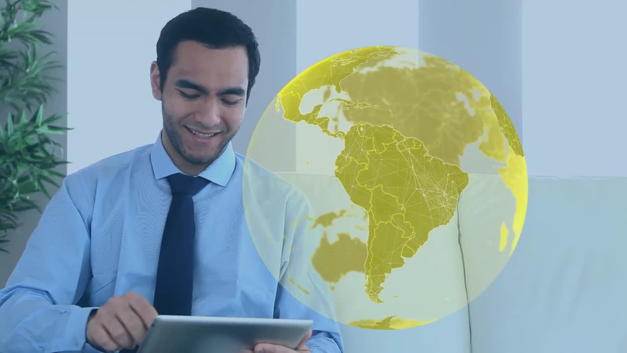 animación del globo sobre un hombre de negocios biracial usando una tableta
