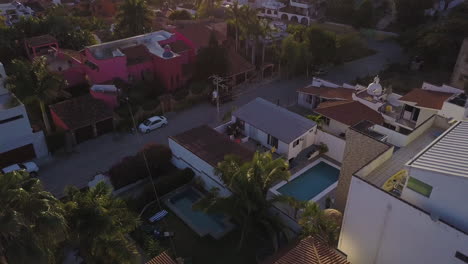 aerial of sunset on beach town in mexico