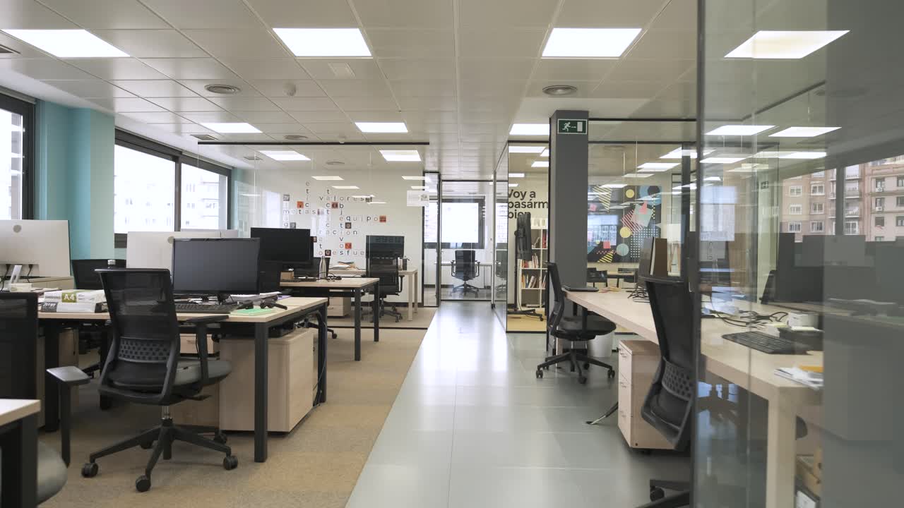 Interior of spacious creative coworking workspace with computer desks