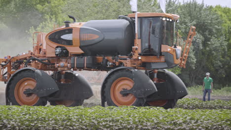 Agricultural-sprayer-moving-on-agricultural-field.-Farming-equipment