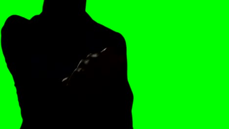 woman making hand gesture against green screen background
