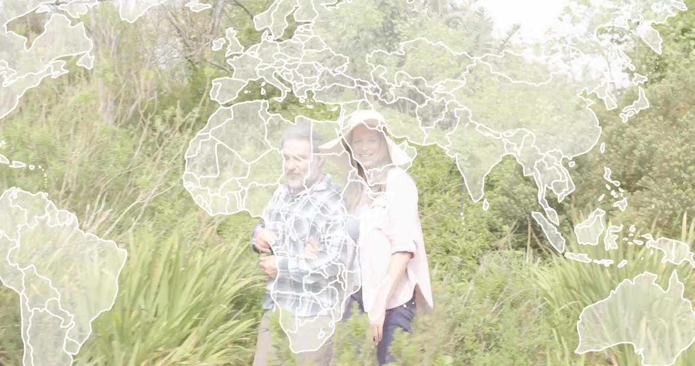 Senior woman linking arms with man entering path causing map overlay demonstrating technology