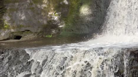 Peaceful-woodland-forest-splashing-rapid-waterfall-slow-motion-flowing-paradise-wilderness-close-up