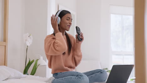 headphones, phone and woman singing in bedroom