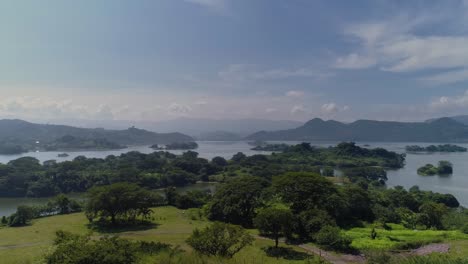 aerial view of the suchitlán lake reservoir in chalatenango, el salvador - dolly in