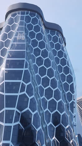 modern futuristic skyscraper with hexagon pattern facade