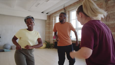 afro couple learning dance with female teacher