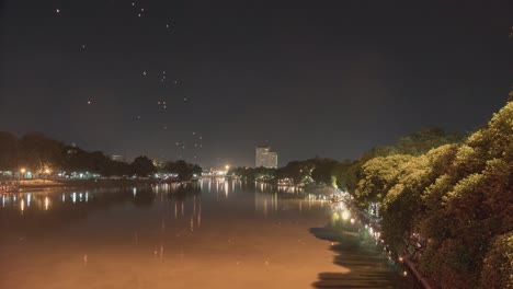 night river scene with floating lanterns