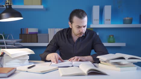 the young historian reading the book about the middle ages is surprised and amazed.