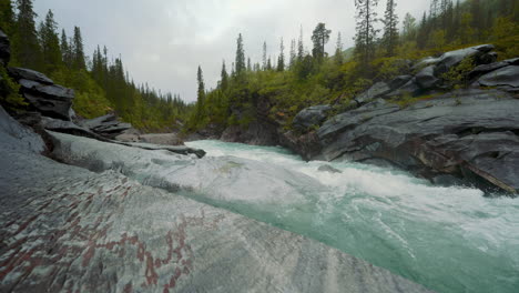 marmorslottet marmorfossen river, mo i rana, norway. nature cinemagraph. water carved marble stone.