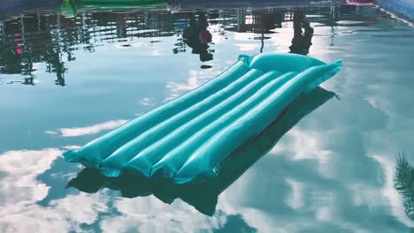 Inflatable-airbed-floats-in-swimming-pool.-Static-shot