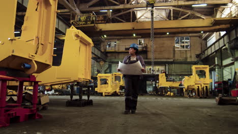 Worker-with-helmet-walking-indoors