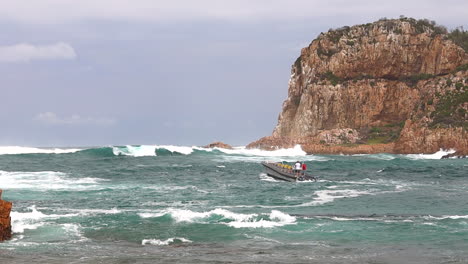 A-commercial-passenger-vessel-slowly-investigates-the-Knysna-Heads-before-turning-back-because-of-the-danger