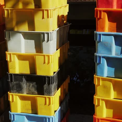Many colorful boxes with grapes at a winery