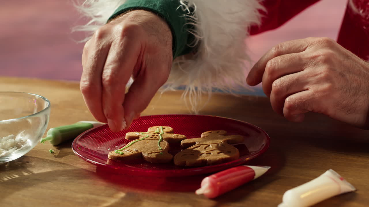 Decorating Christmas Gingerbread Cookies with Santa Claus