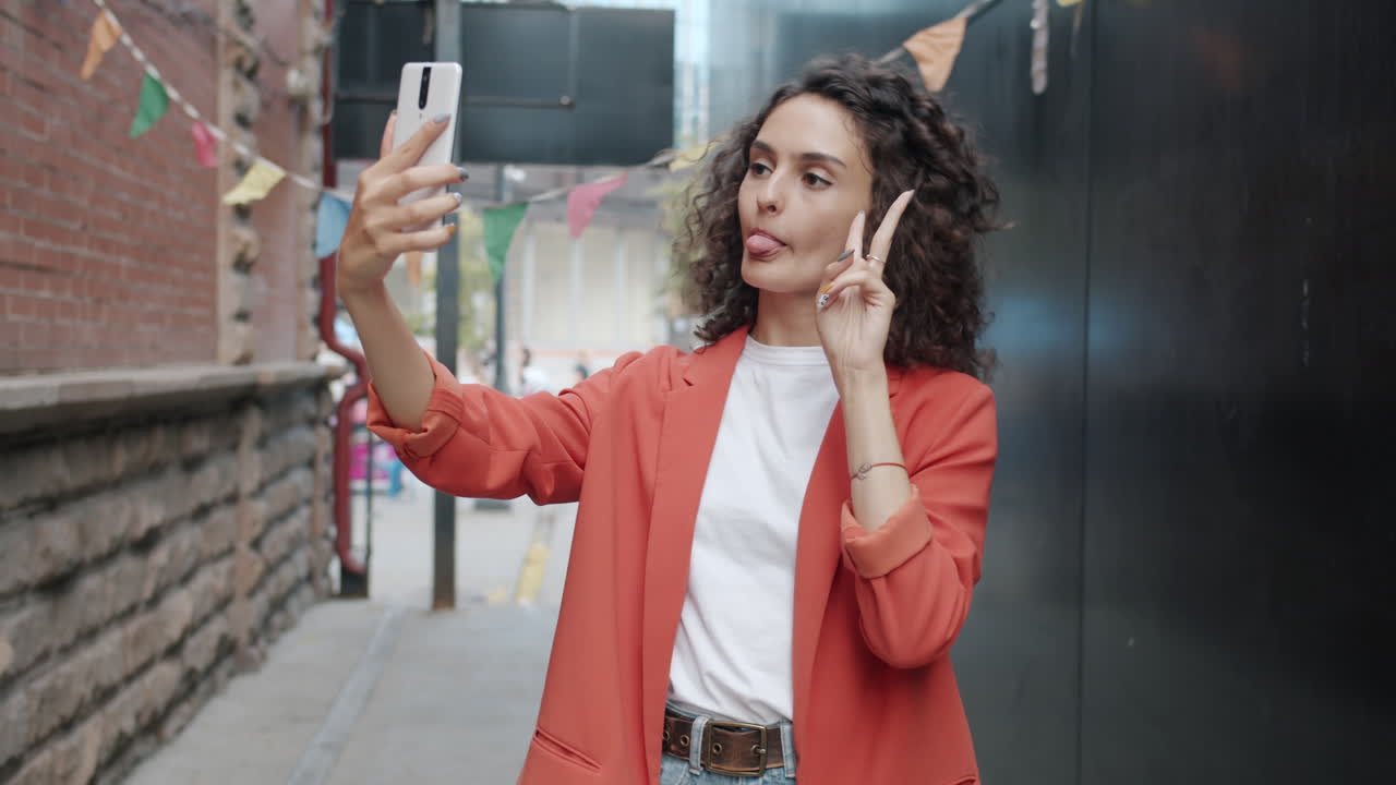 Woman Taking Selfie in an Urban Alley