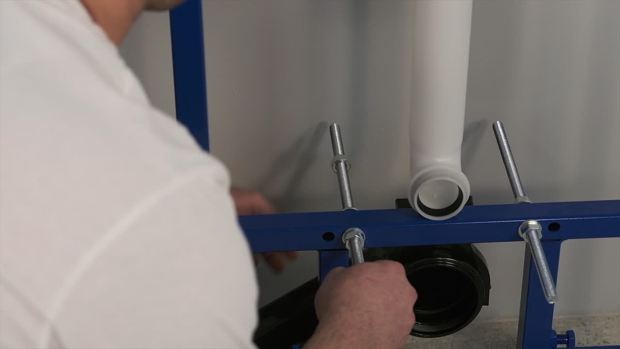 the worker who repairs and installs the toilet bowl and flush uses tools such as pliers and spanners