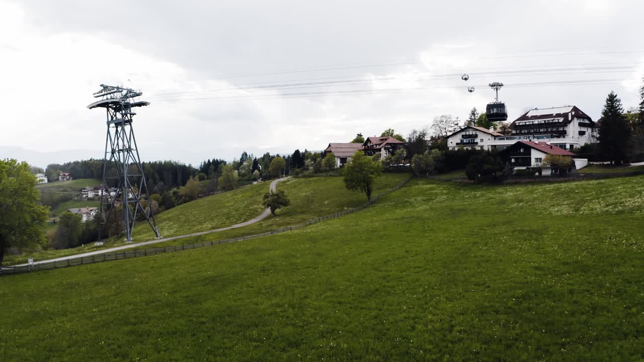 Aerial view of a tram passing through Italy's Domolite mountains