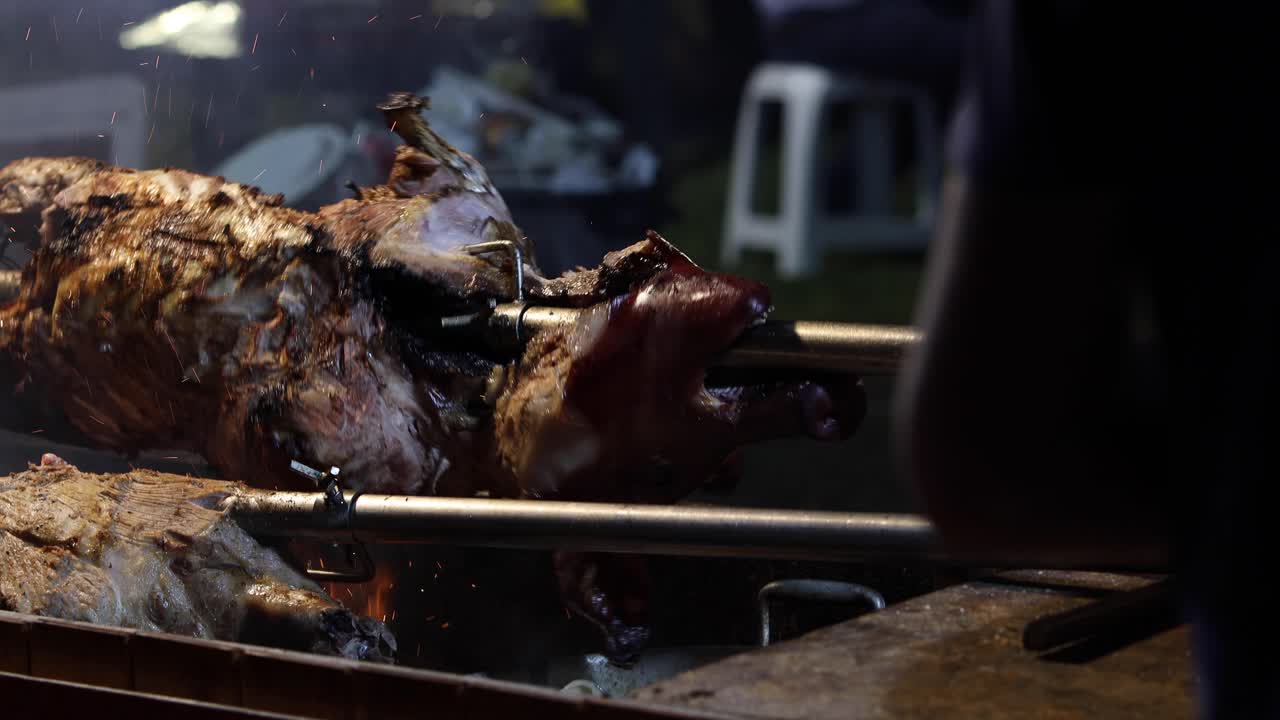 Street Food. Pork being cooked over a hot charcoal fire