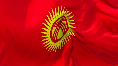 kyrgyzstan flag waving in wind slow motion animation . 4k realistic fabric texture flag smooth blowing on a windy day continuous seamless loop background.