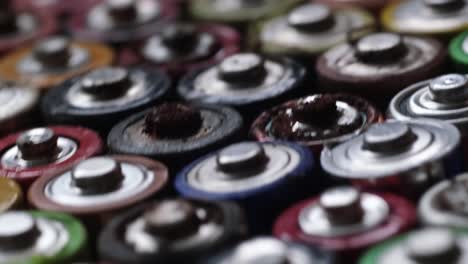 closeup of used aa finger batteries closeup of used aa finger batteries background of rotating batteries harmful effects of batteries