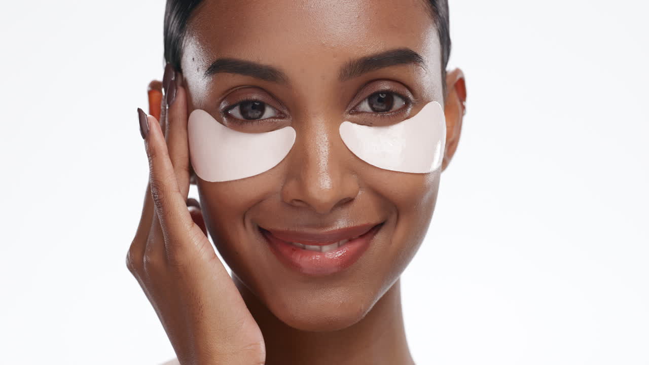 Face, eye patches and woman with skincare
