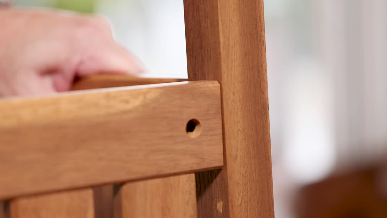 Hands assembling wooden furniture using dowel joints in a well-lit indoor setting. Close-up shots highlight precision and craftsmanship