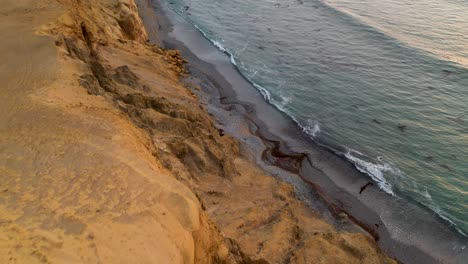 beautiful ocean scenery of shoreline beach on paracas, peru - aerial
