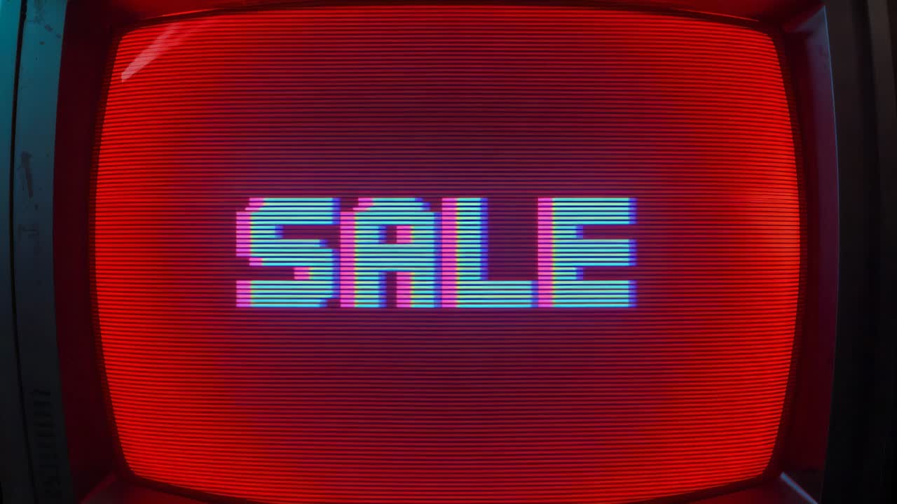 Signal causing retro CRT television showing SALE in dim room, with scanlines, chromatic ghosting
