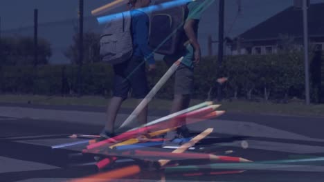 video compuesto de lápices de color que caen contra los niños de la escuela corriendo mientras cruzan la calle