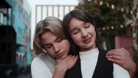 teenage boy and girl hugging