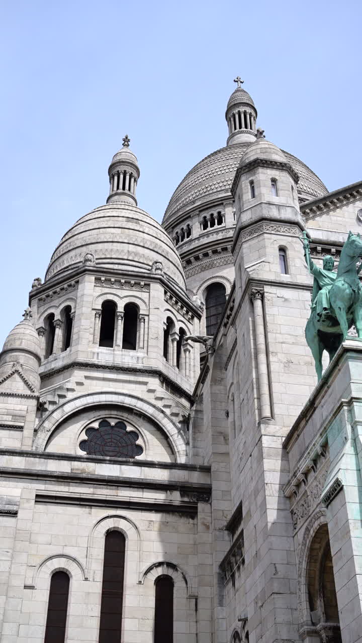 Front view of the Basilica of Sacre-Coeur de Montmartre in Montmartre, Paris, France. Vertical
