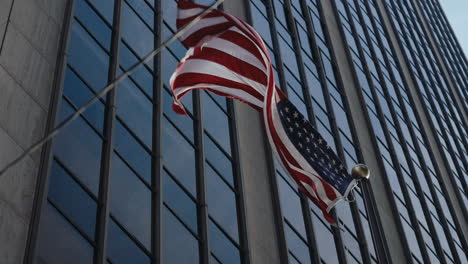 american flag on a skyscraper