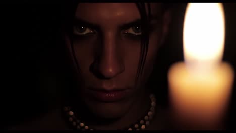woman in shadow with candle