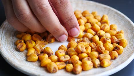 crispy roasted corn kernels on a plate