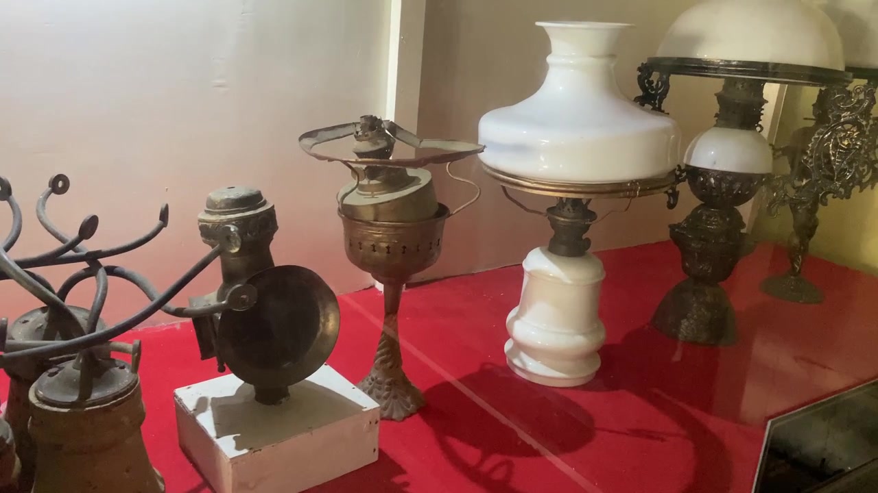 Collection of Vintage Oil Lamps and Antique Lighting Fixtures on Display
