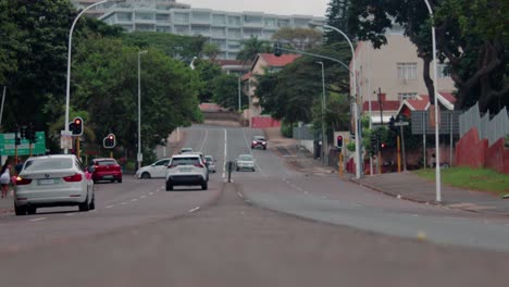 morning side durban south africa base eye view of the center road with cars and buildings surrounding