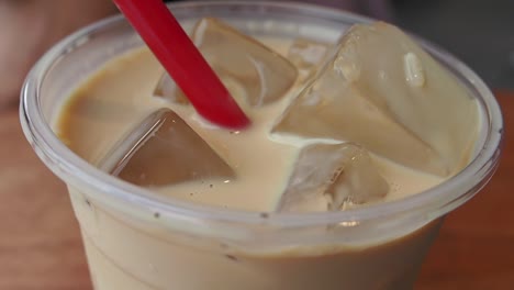 close-up of a glass of iced coffee with ice cubes