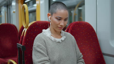 woman using tablet on a train