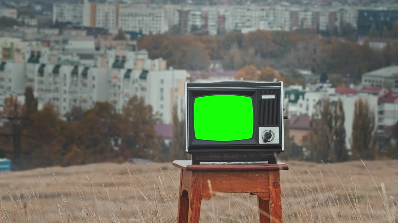 Old Television With Green Screen. Aesthetics of the 80s.