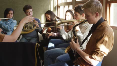 teenage musicians rehearsing