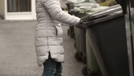 Emptying-the-wheelie-bin