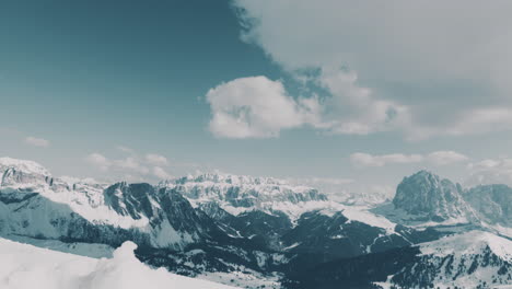 Light-clouds-moving-above-Dolomites-mountain-ridges-time-lapse